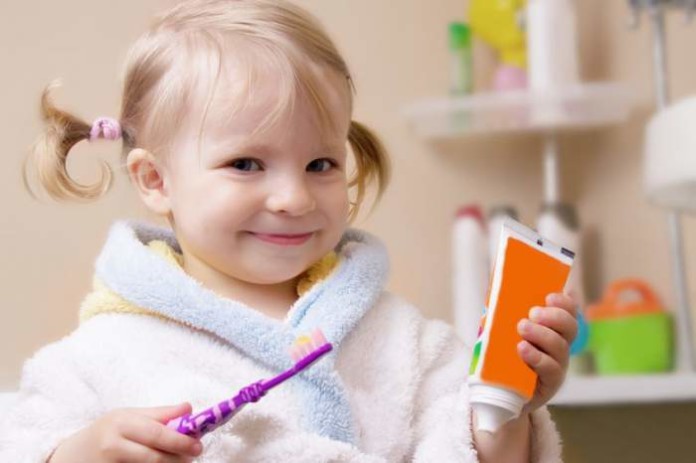 child brushing teeth